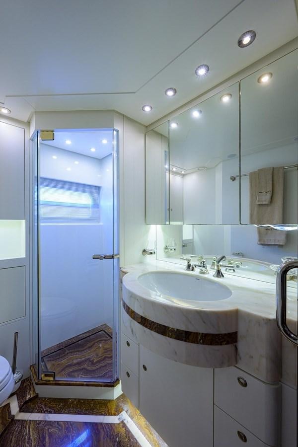 a bathroom with a sink and a mirror aboard TEMPO REALE Yacht for Sale