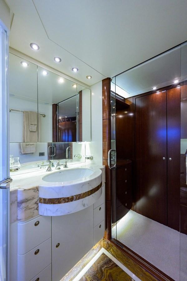 a bathroom with a sink and a mirror aboard TEMPO REALE Yacht for Sale
