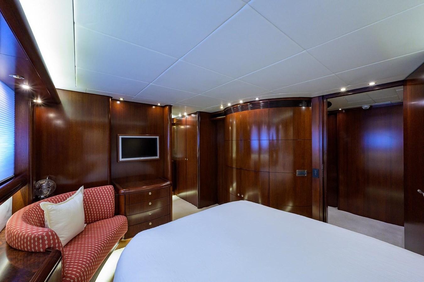 a room with a bed and a television aboard TEMPO REALE Yacht for Sale