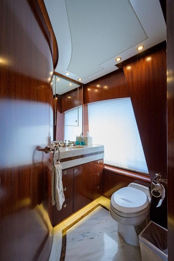 a bathroom with a toilet and a sink aboard TEMPO REALE Yacht for Sale