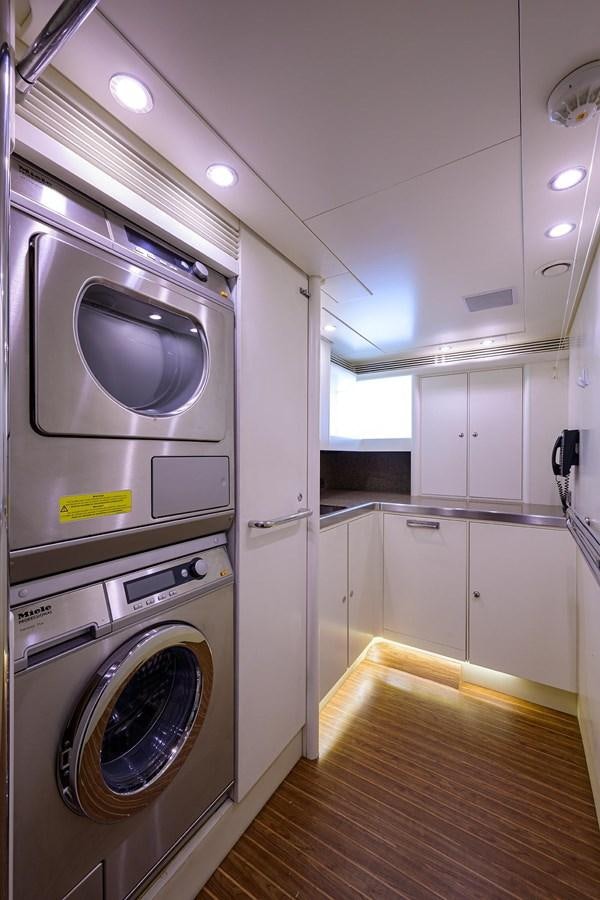 a room with a washer and dryer aboard TEMPO REALE Yacht for Sale