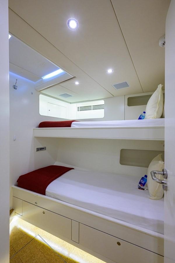 a room with a bed and a window aboard TEMPO REALE Yacht for Sale