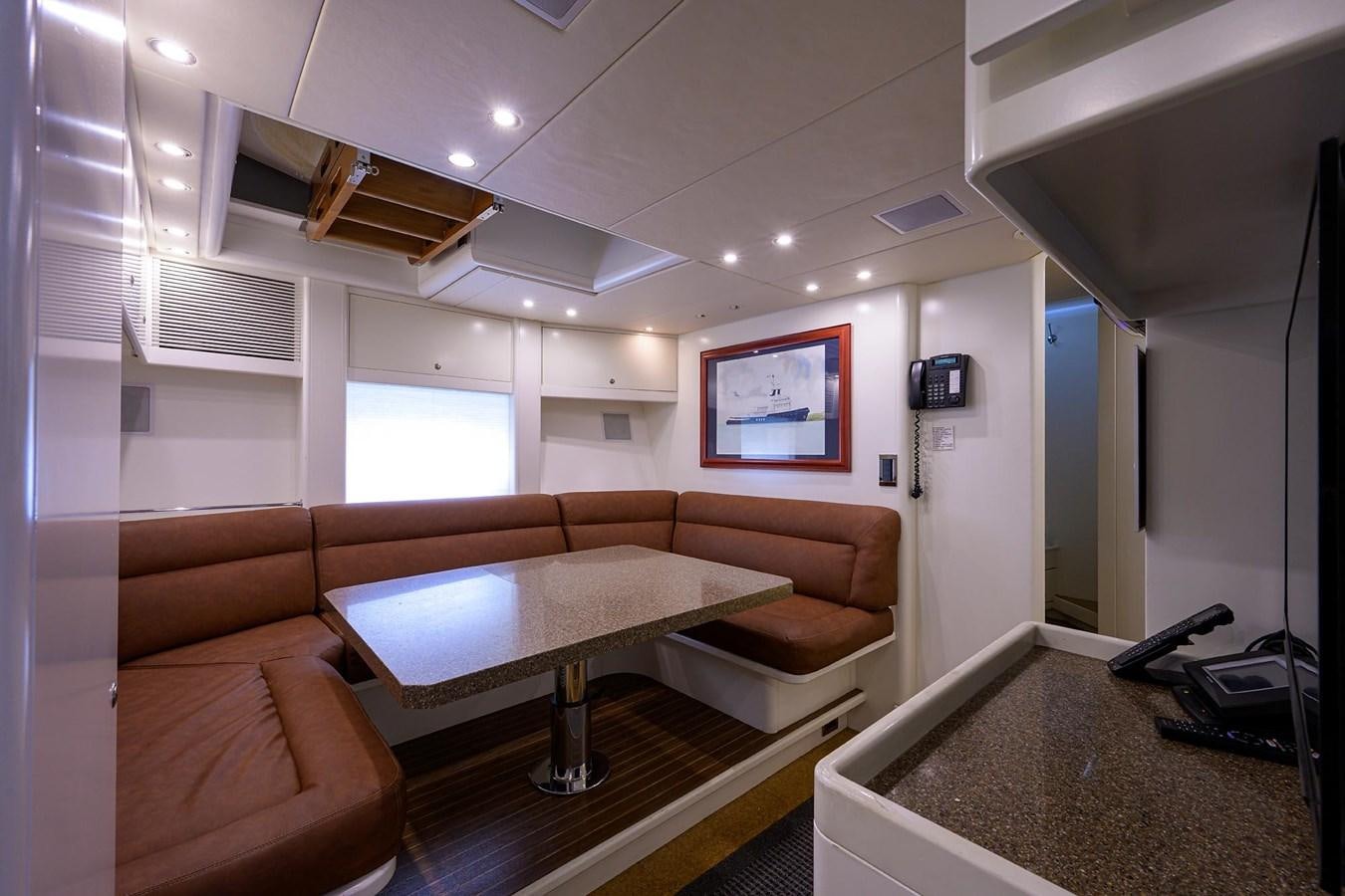 a living room with a couch and a tv aboard TEMPO REALE Yacht for Sale