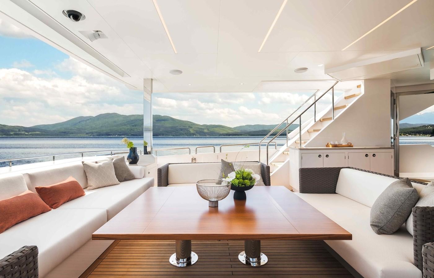 a living room with a large window aboard FD110-004 NEW ARRIVAL Yacht for Sale
