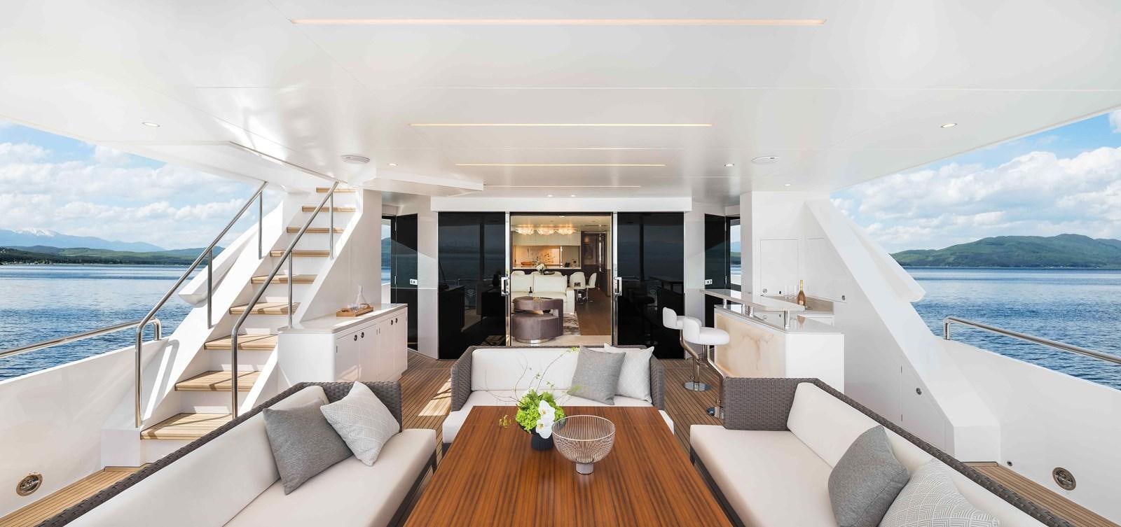 a living room with a large balcony aboard FD110-004 NEW ARRIVAL Yacht for Sale