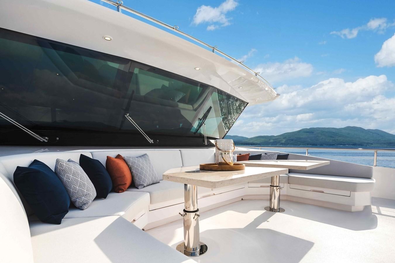 a glass and wood table on a boat on the water aboard FD110-004 NEW ARRIVAL Yacht for Sale