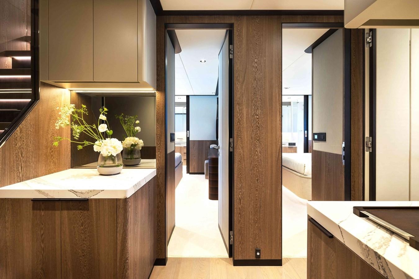 a room with a table and cabinets aboard FD110-004 NEW ARRIVAL Yacht for Sale