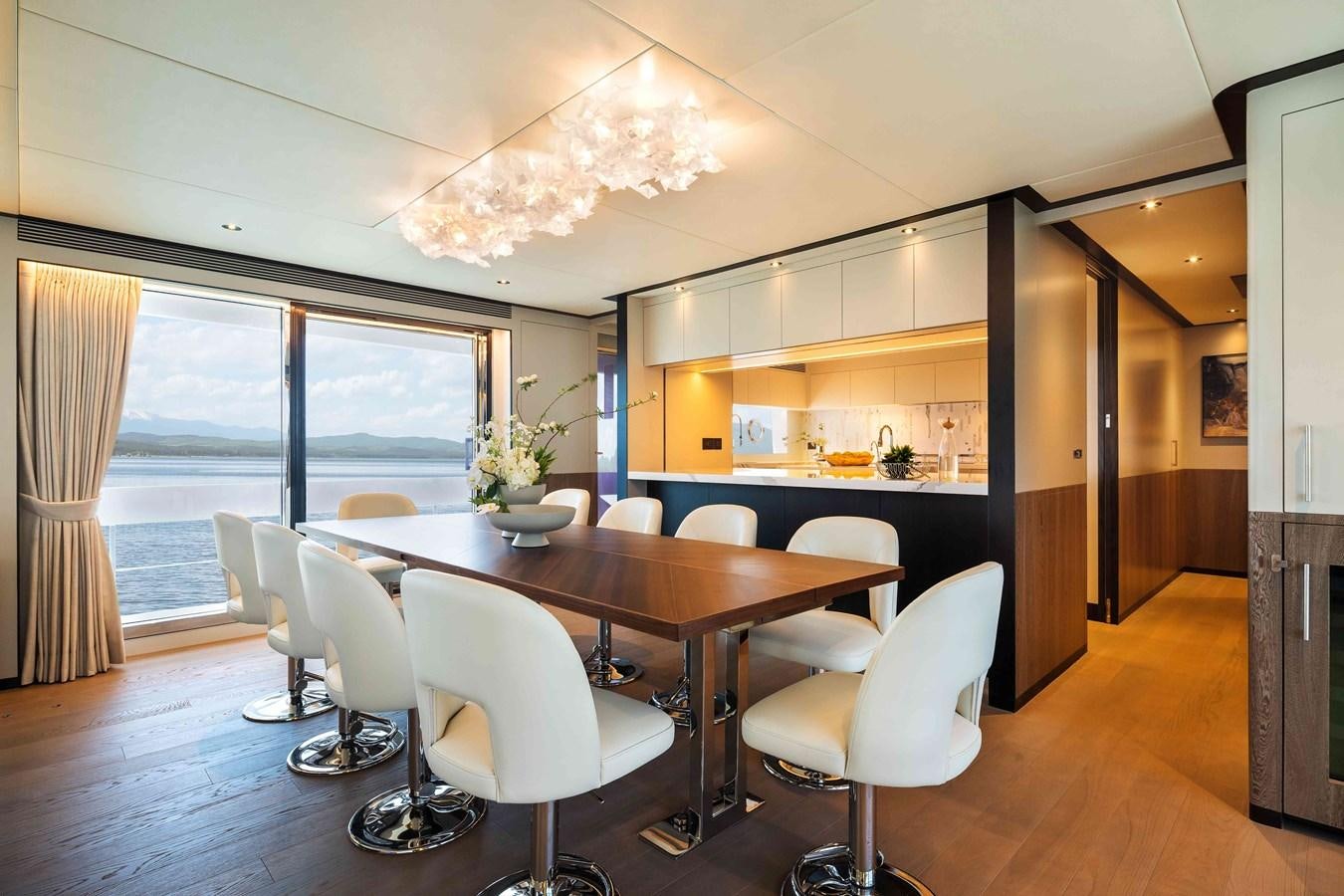 a large kitchen with a dining table aboard FD110-004 NEW ARRIVAL Yacht for Sale