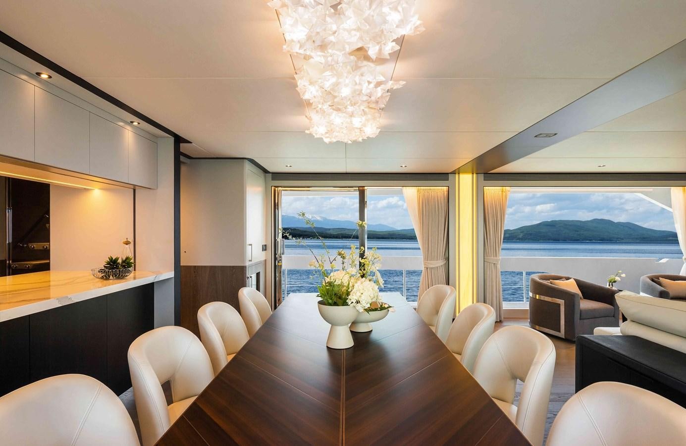 a dining room with a large window aboard FD110-004 NEW ARRIVAL Yacht for Sale