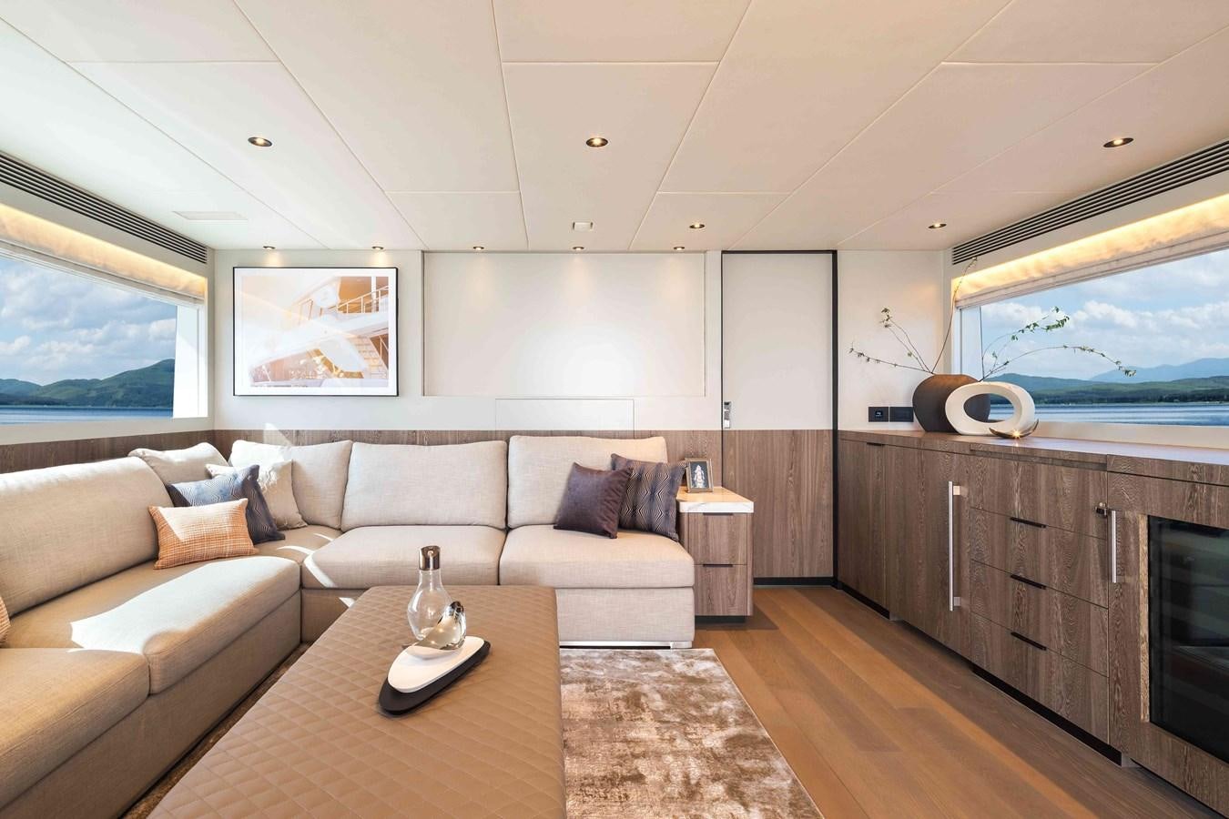 a living room with a couch and a fireplace aboard FD110-004 NEW ARRIVAL Yacht for Sale