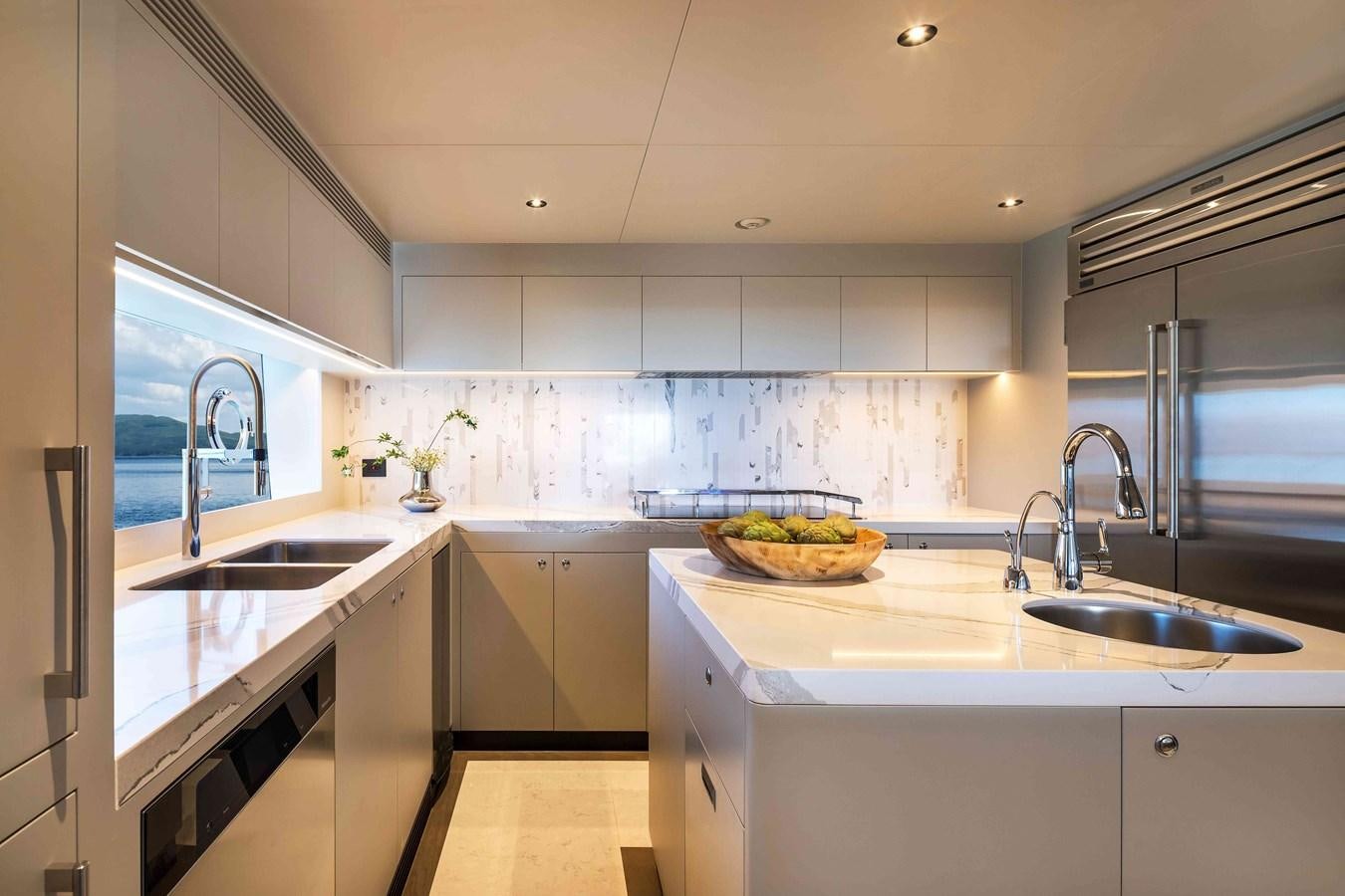 a kitchen with white cabinets aboard FD110-004 NEW ARRIVAL Yacht for Sale