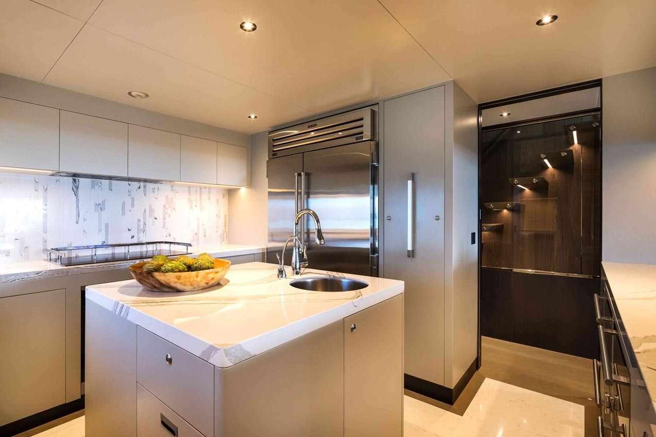 a kitchen with a sink and refrigerator aboard FD110-004 NEW ARRIVAL Yacht for Sale