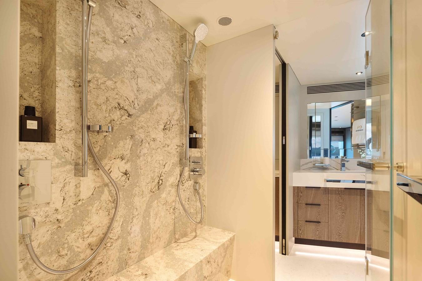 a bathroom with a glass shower aboard FD110-004 NEW ARRIVAL Yacht for Sale