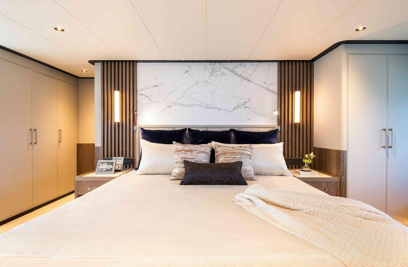 a large bed with white sheets aboard FD110-004 NEW ARRIVAL Yacht for Sale