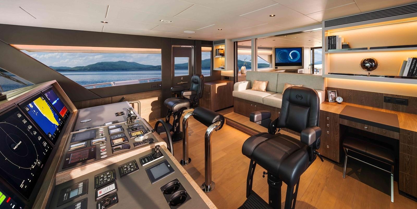 a room with a desk and chairs aboard FD110-004 NEW ARRIVAL Yacht for Sale