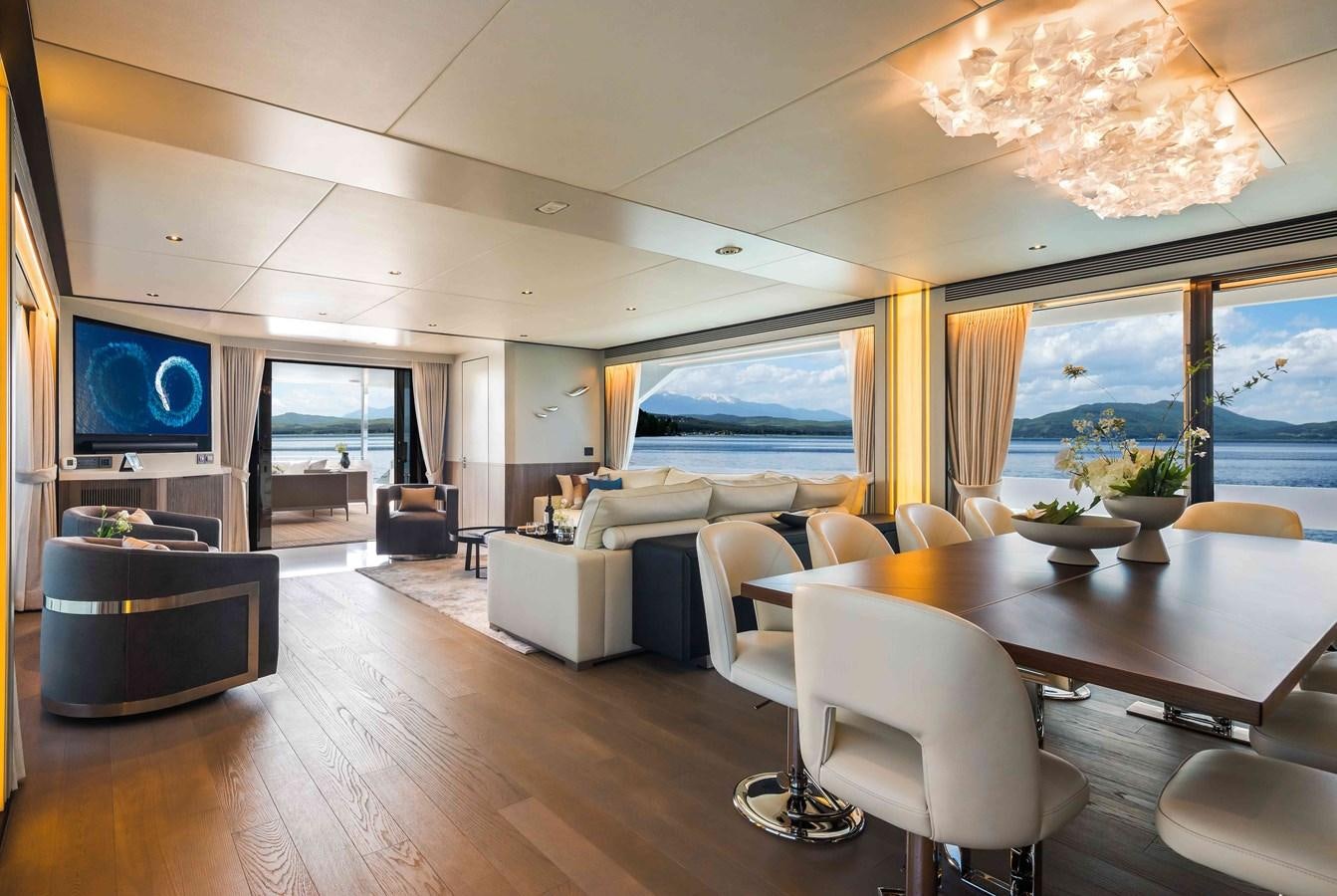 a living room with a large screen aboard FD110-004 NEW ARRIVAL Yacht for Sale
