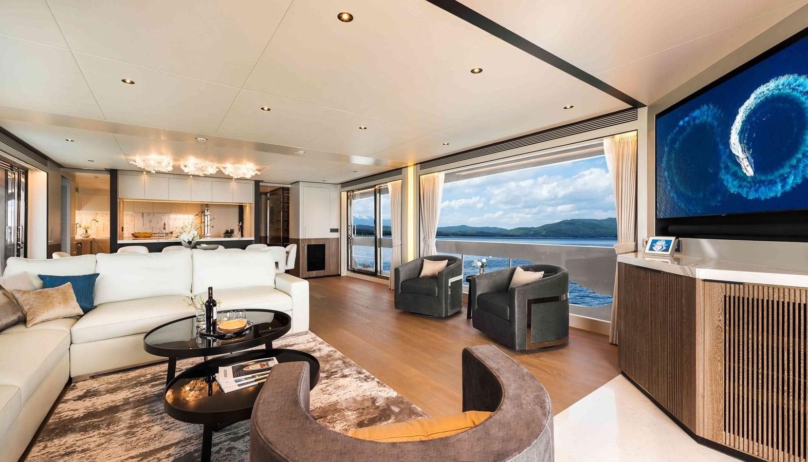 a living room with a large window aboard FD110-004 NEW ARRIVAL Yacht for Sale