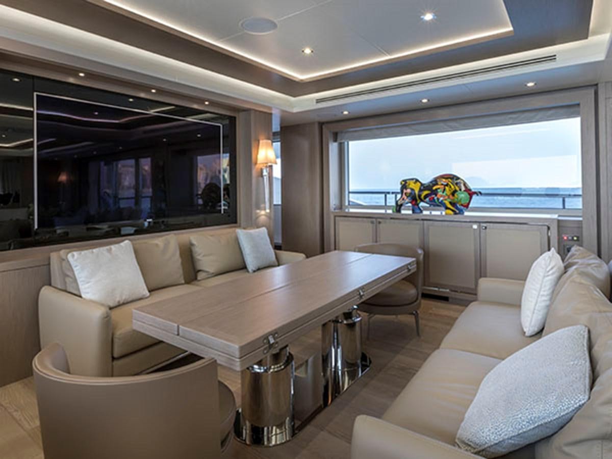 a living room with a large window aboard FREEDOM Yacht for Sale