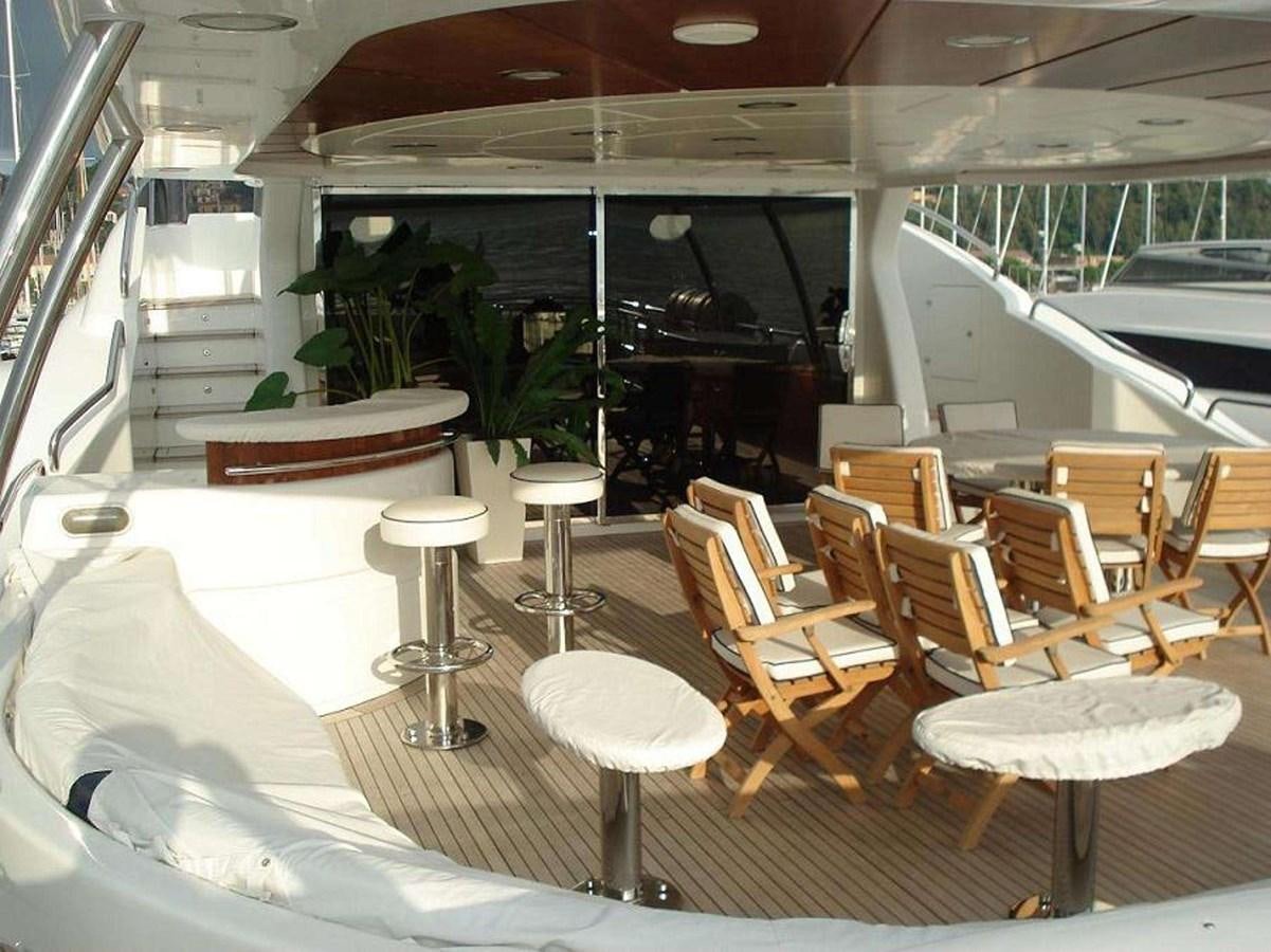 a room with tables and chairs aboard ENIGMA Yacht for Sale
