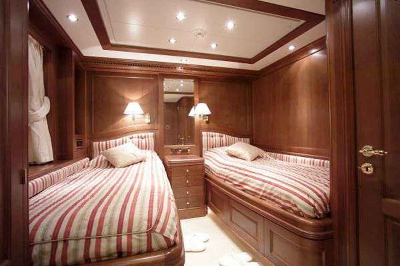 a couple of beds in a room aboard ENIGMA Yacht for Sale