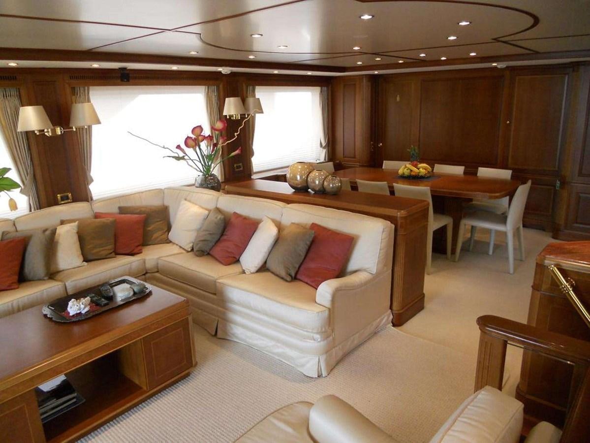 a living room with a couch and a table aboard ENIGMA Yacht for Sale