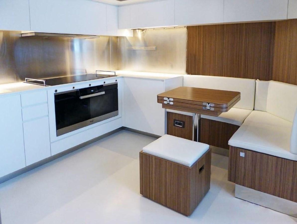 a kitchen with a sink and a stool aboard 100 RIVA CORSARO Yacht for Sale