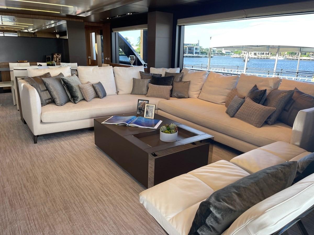 a living room with a large window aboard 100 RIVA CORSARO Yacht for Sale