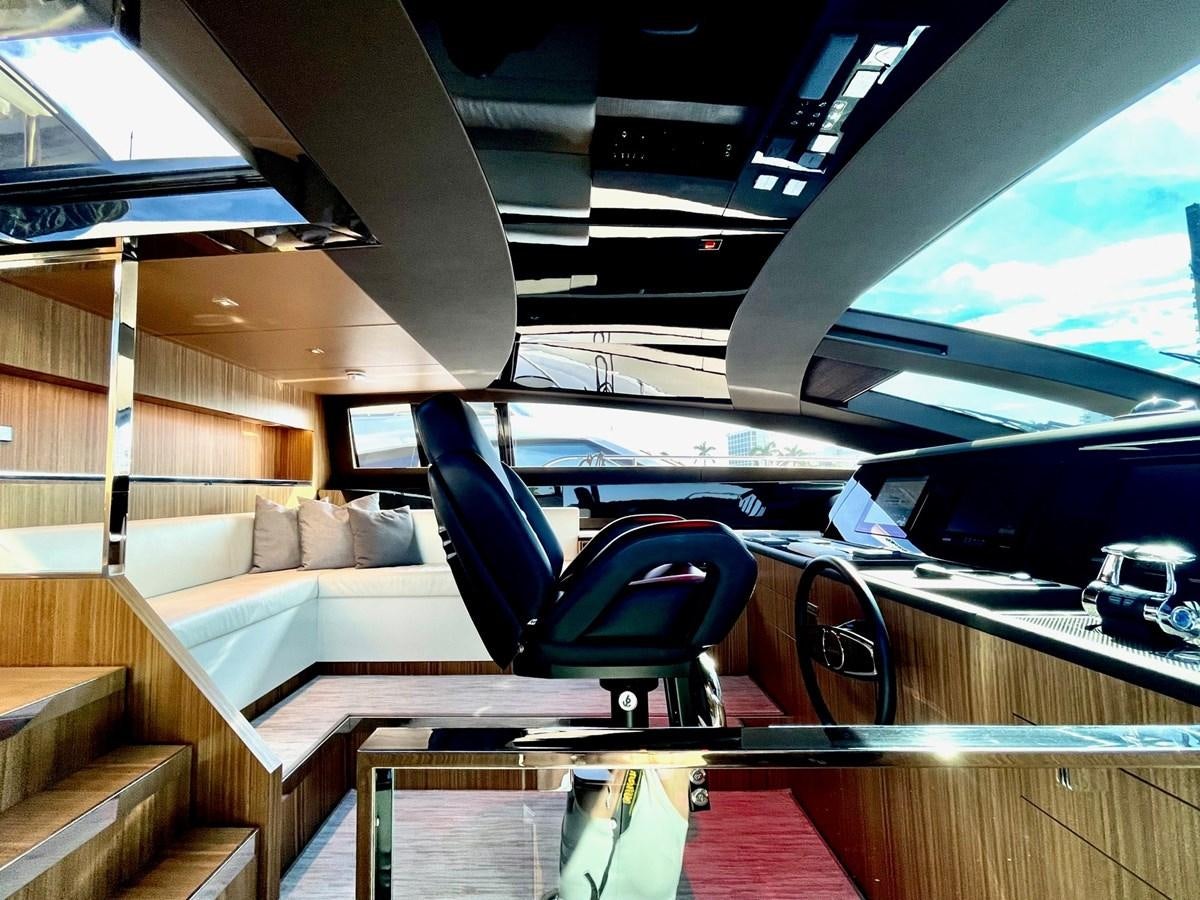 a train with a couch and a chair aboard 100 RIVA CORSARO Yacht for Sale