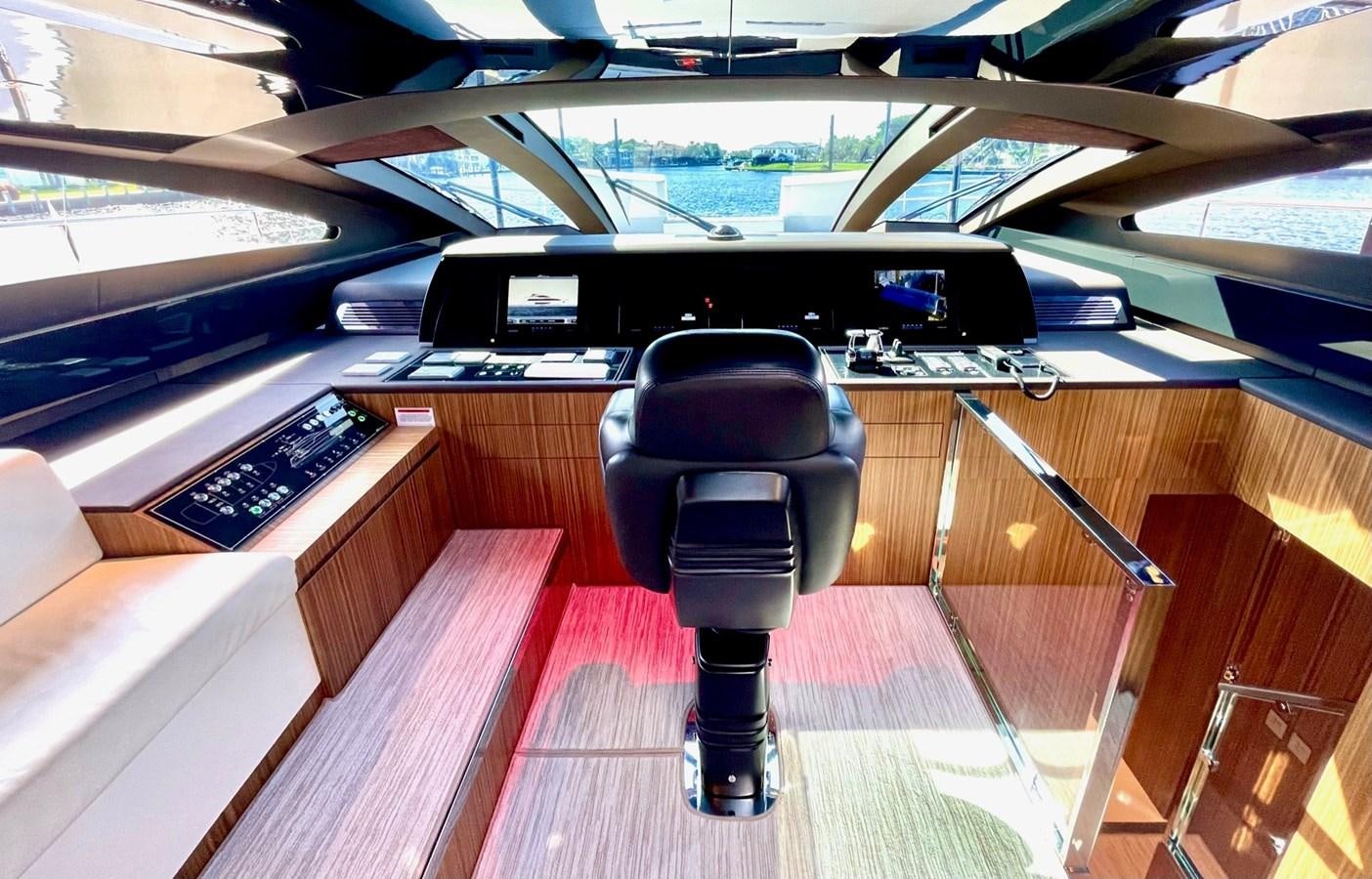 a black and blue desk chair in a car aboard 100 RIVA CORSARO Yacht for Sale