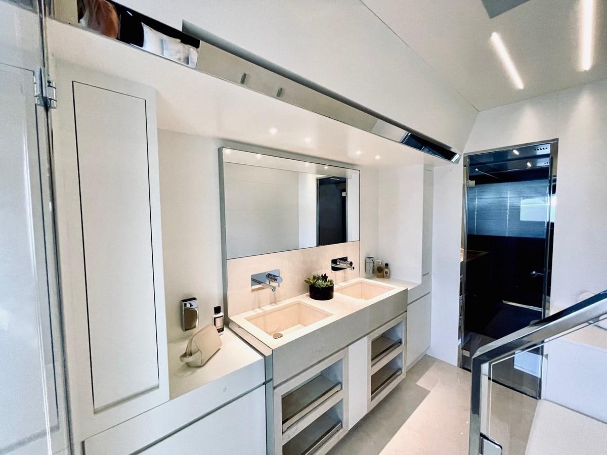 a bathroom with a sink and cabinets aboard 100 RIVA CORSARO Yacht for Sale