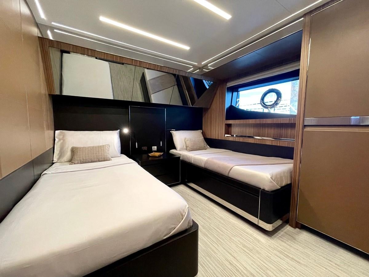 a room with a bed and a window aboard 100 RIVA CORSARO Yacht for Sale