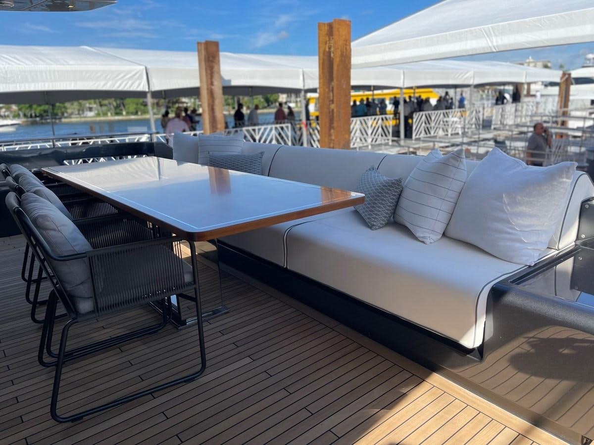 a couch and a table on a deck aboard 100 RIVA CORSARO Yacht for Sale