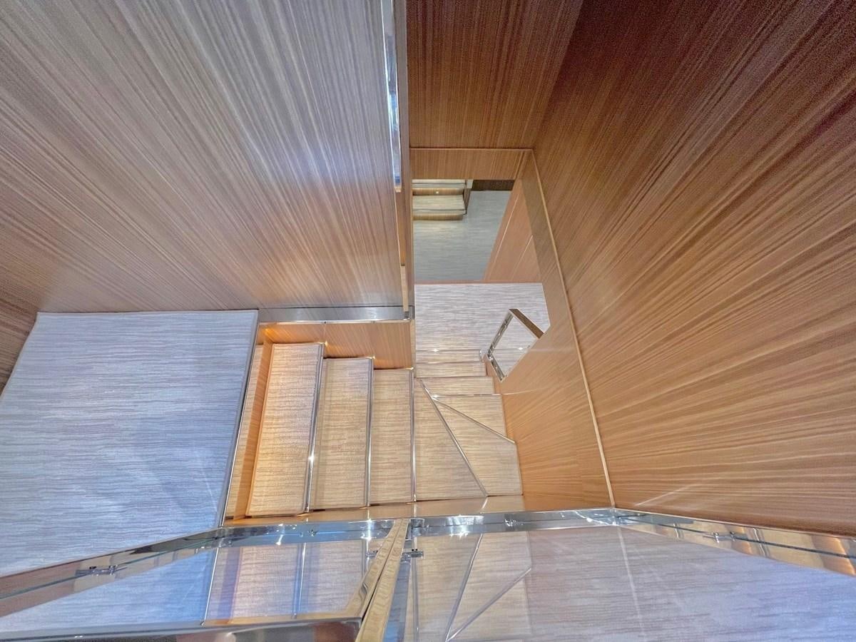 a wooden staircase with wooden walls aboard 100 RIVA CORSARO Yacht for Sale