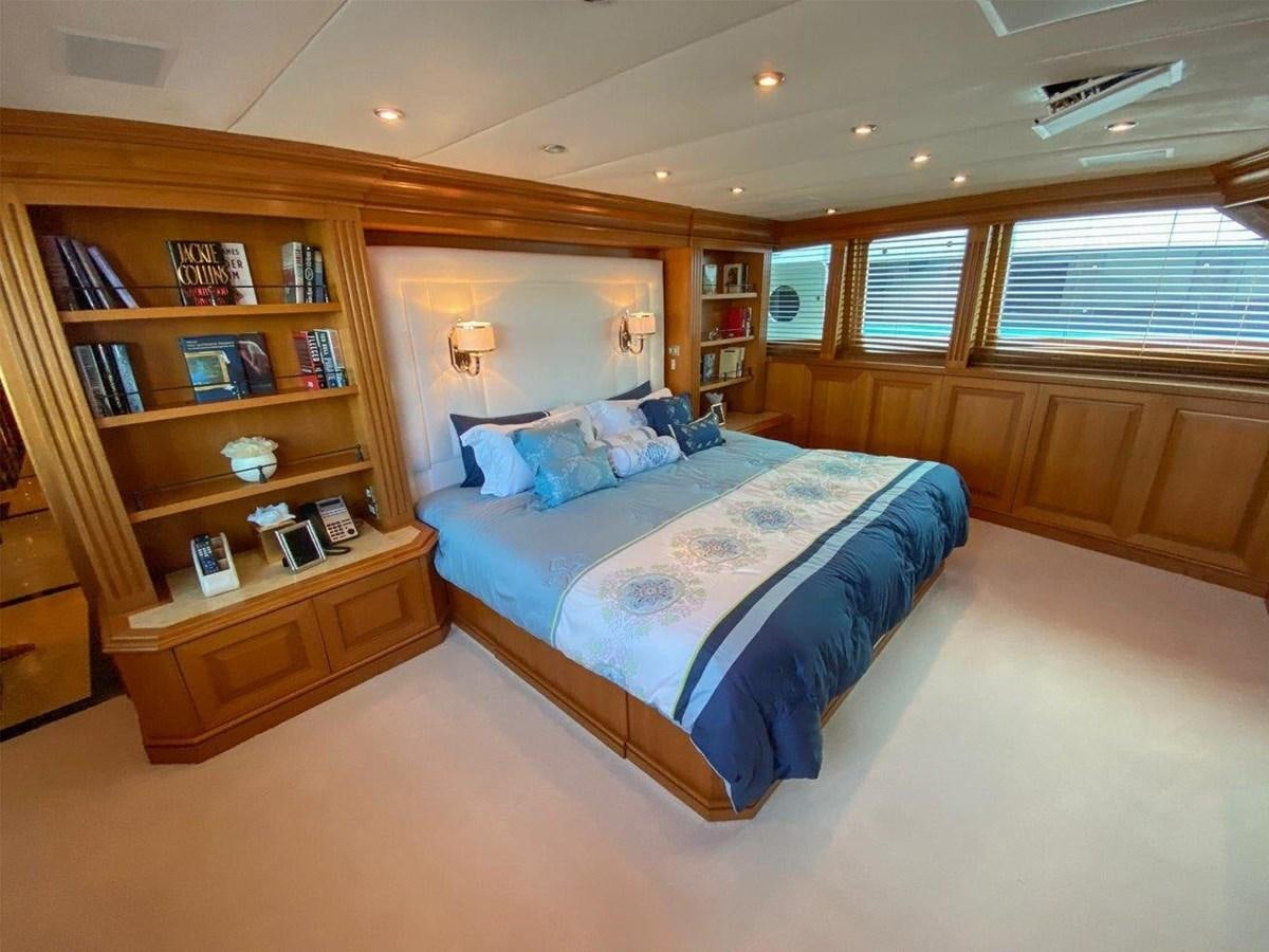 a bedroom with a large bed aboard KOKOMO NIGHTS Yacht for Sale