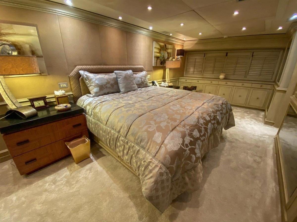 a large bedroom with a large bed aboard KOKOMO NIGHTS Yacht for Sale