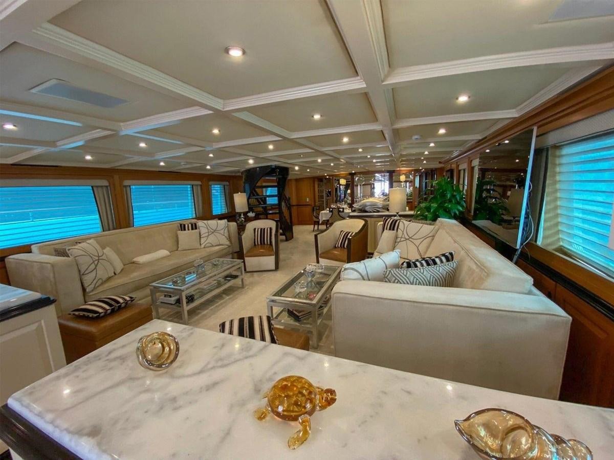 a living room with a large window aboard KOKOMO NIGHTS Yacht for Sale