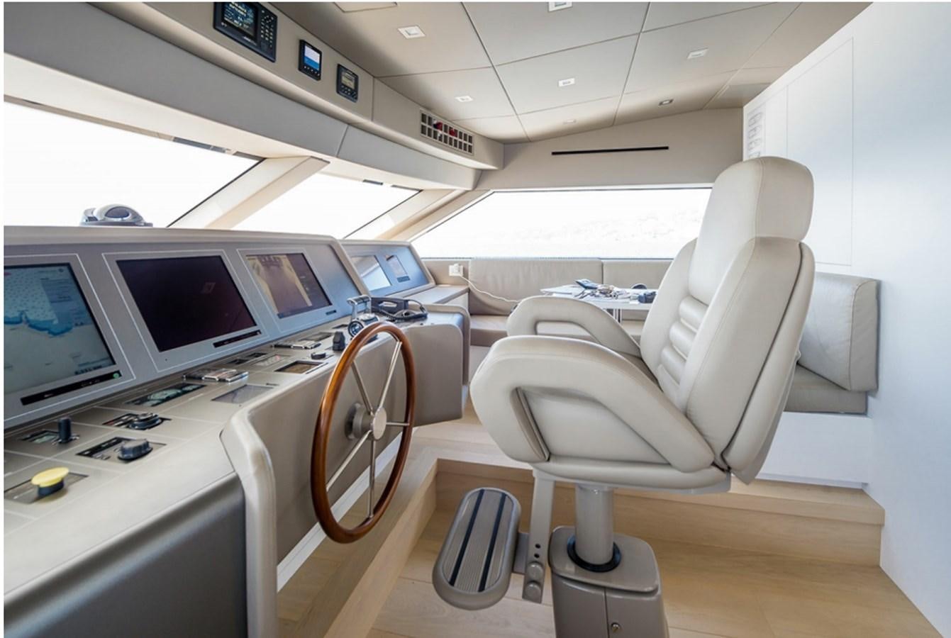 a room with a desk and chairs aboard SANLORENZO SD112 Yacht for Sale