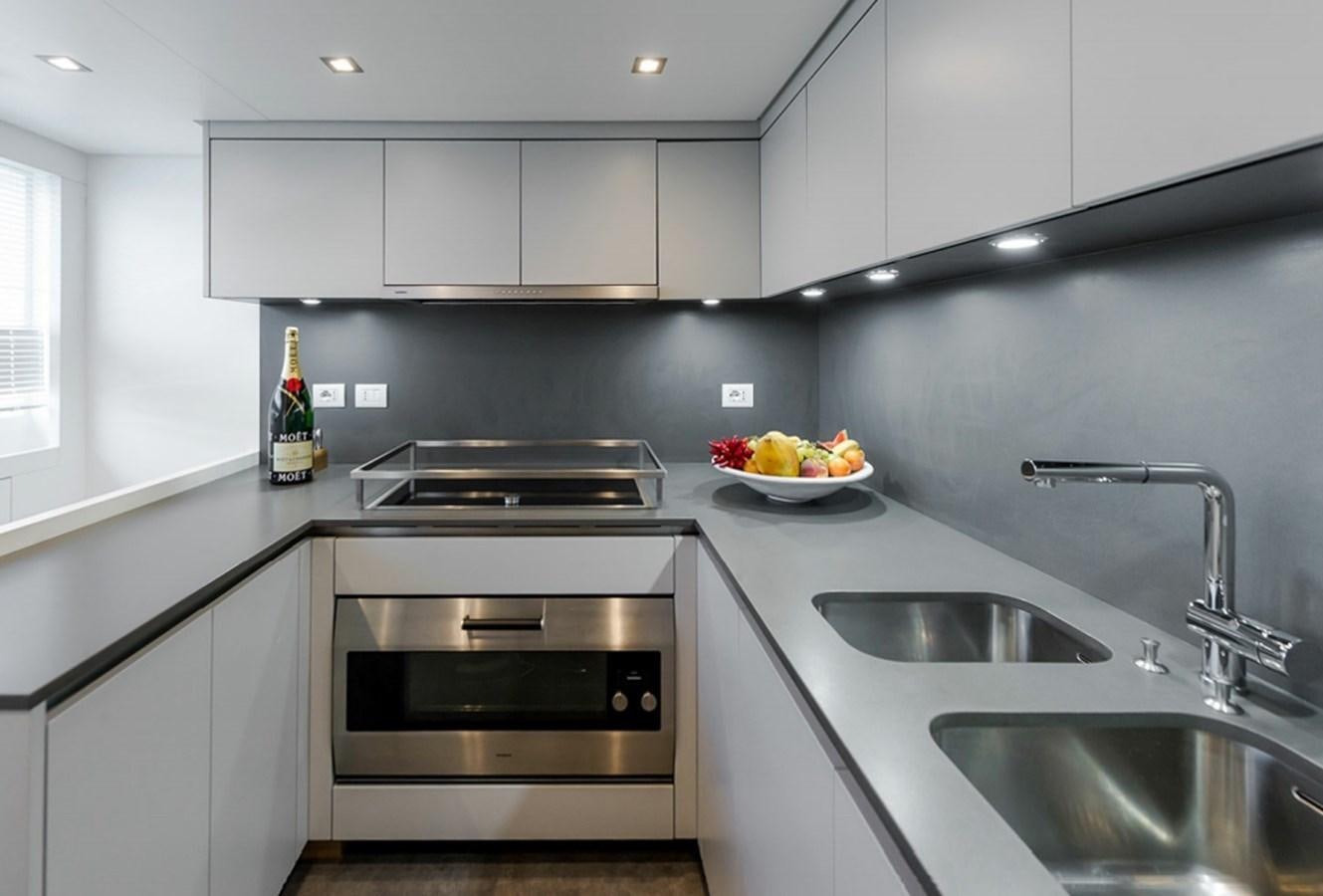 a kitchen with a bowl of fruit aboard SANLORENZO SD112 Yacht for Sale