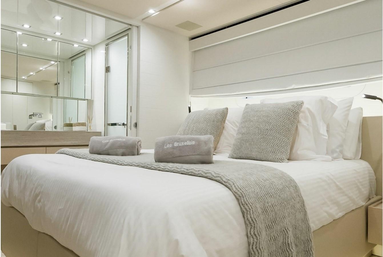 a bed with pillows on it aboard SANLORENZO SD112 Yacht for Sale