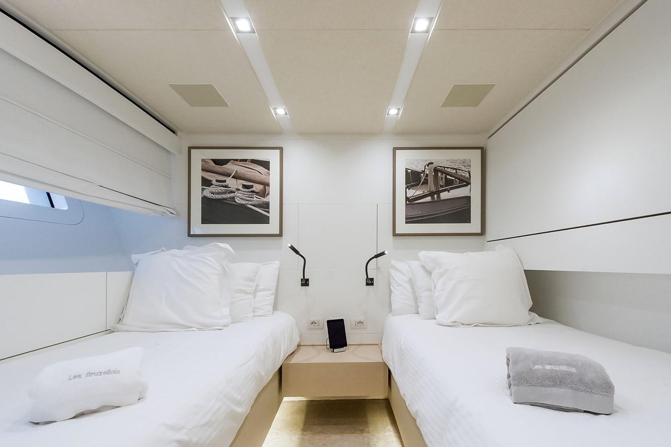 a room with white beds aboard SANLORENZO SD112 Yacht for Sale