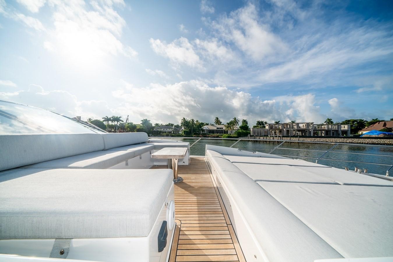 a deck with a view of a city and water aboard CIAO BELLA Yacht for Sale