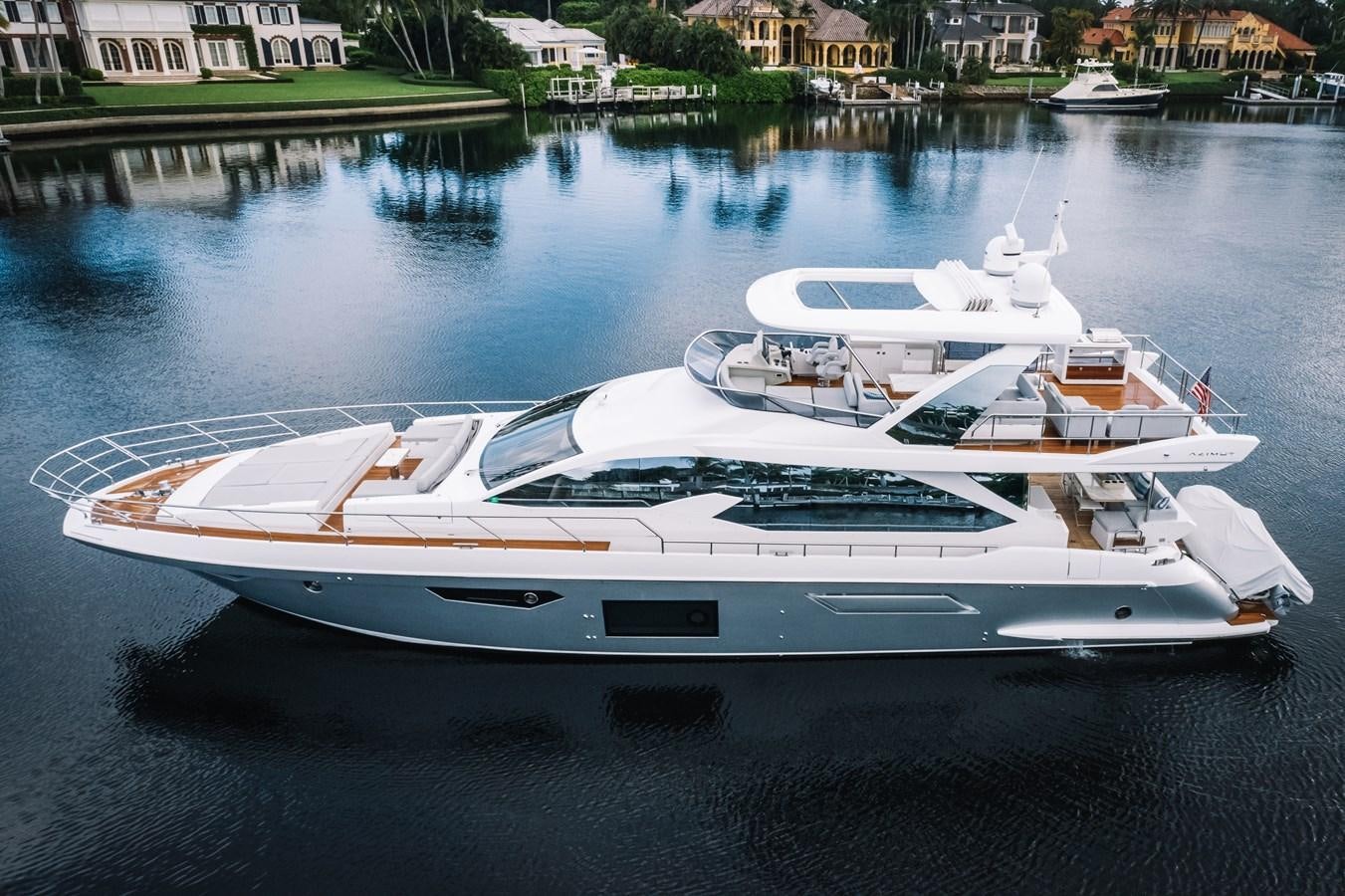 a white yacht on the water aboard CIAO BELLA Yacht for Sale