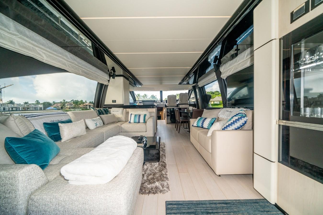 a train with couches and a table aboard CIAO BELLA Yacht for Sale