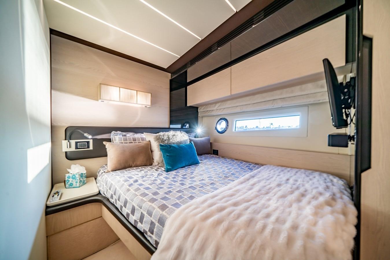 a room with a bed and a desk aboard CIAO BELLA Yacht for Sale