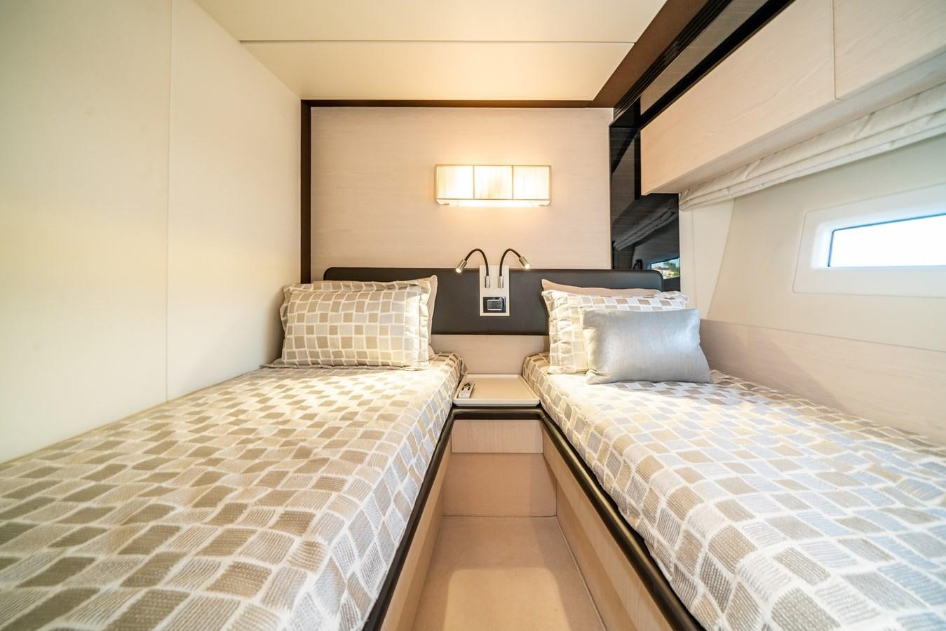 a couple of beds in a room aboard CIAO BELLA Yacht for Sale