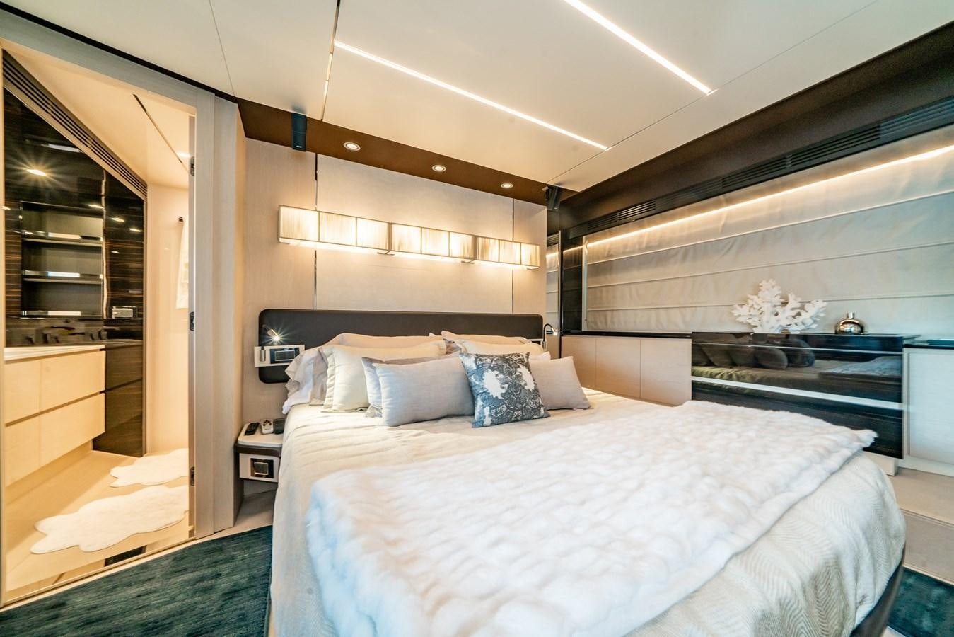 a bed in a room aboard CIAO BELLA Yacht for Sale