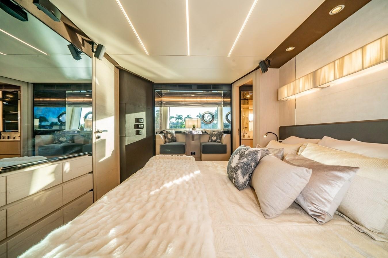 a bed with pillows and a bed aboard CIAO BELLA Yacht for Sale