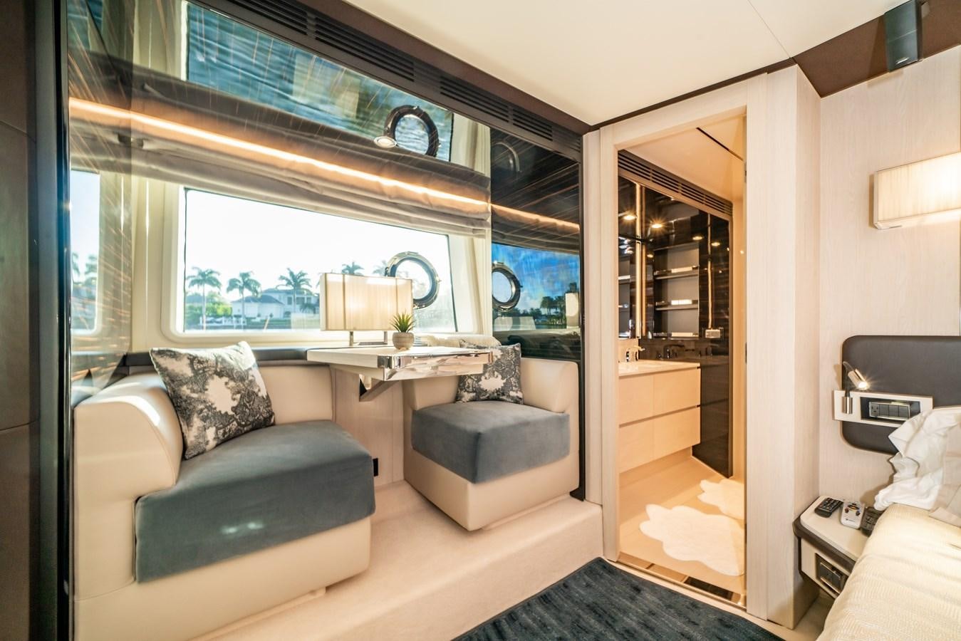 a living room with a large window aboard CIAO BELLA Yacht for Sale