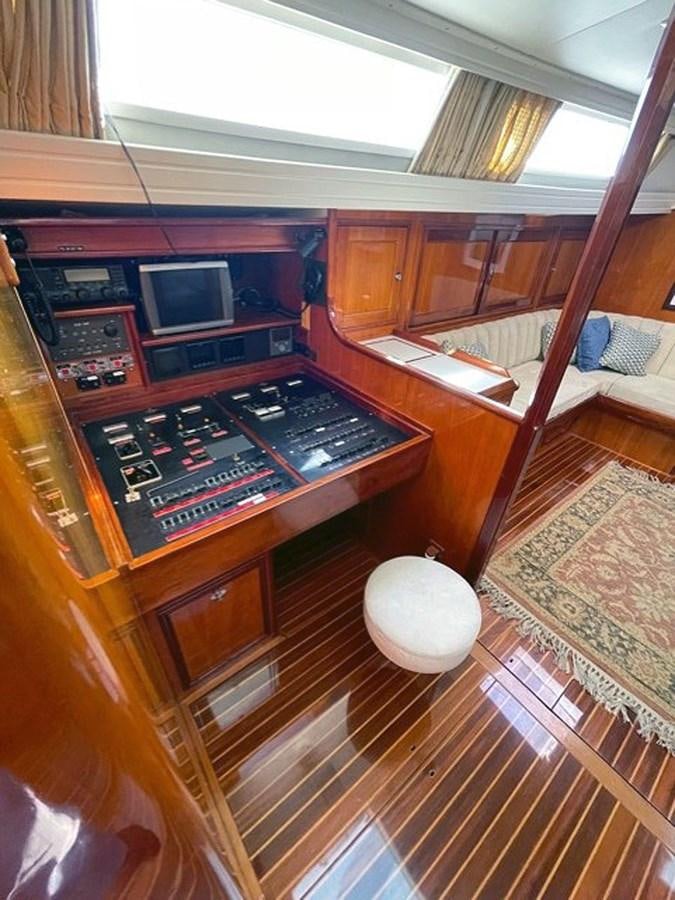 a small kitchen with a wood stove aboard SIROCCO Yacht for Sale