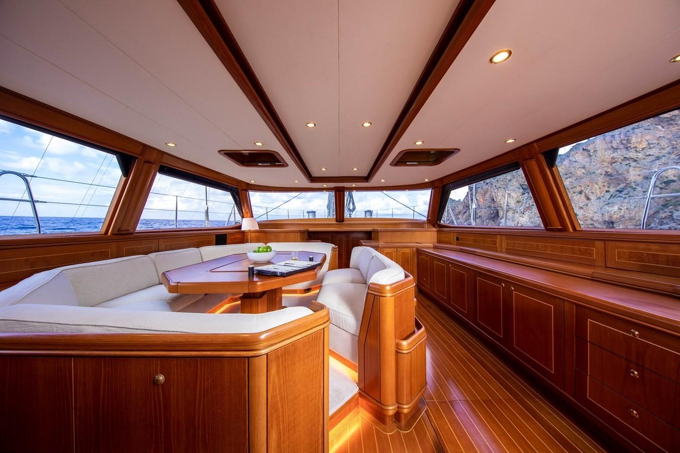 a room with a bed and a table aboard MYSTERY Yacht for Sale